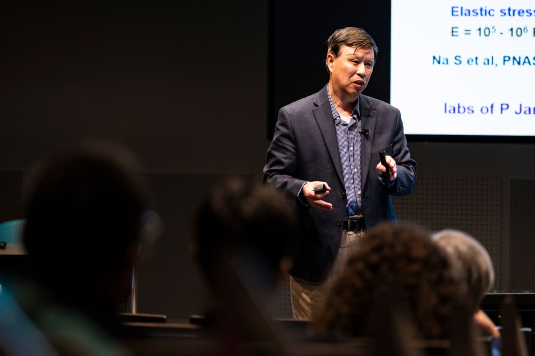 Ning Wang speaking at a global summit.