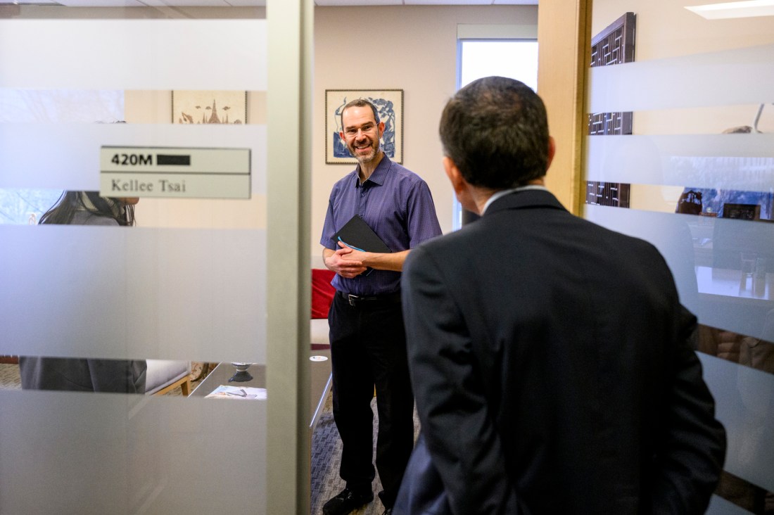 David Madigan surprising Daniel Aldrich in Kelle Tsai's office.