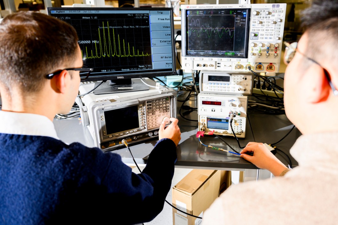 Minghan Liu and Nicolas Casilli sitting in front of computer screens.