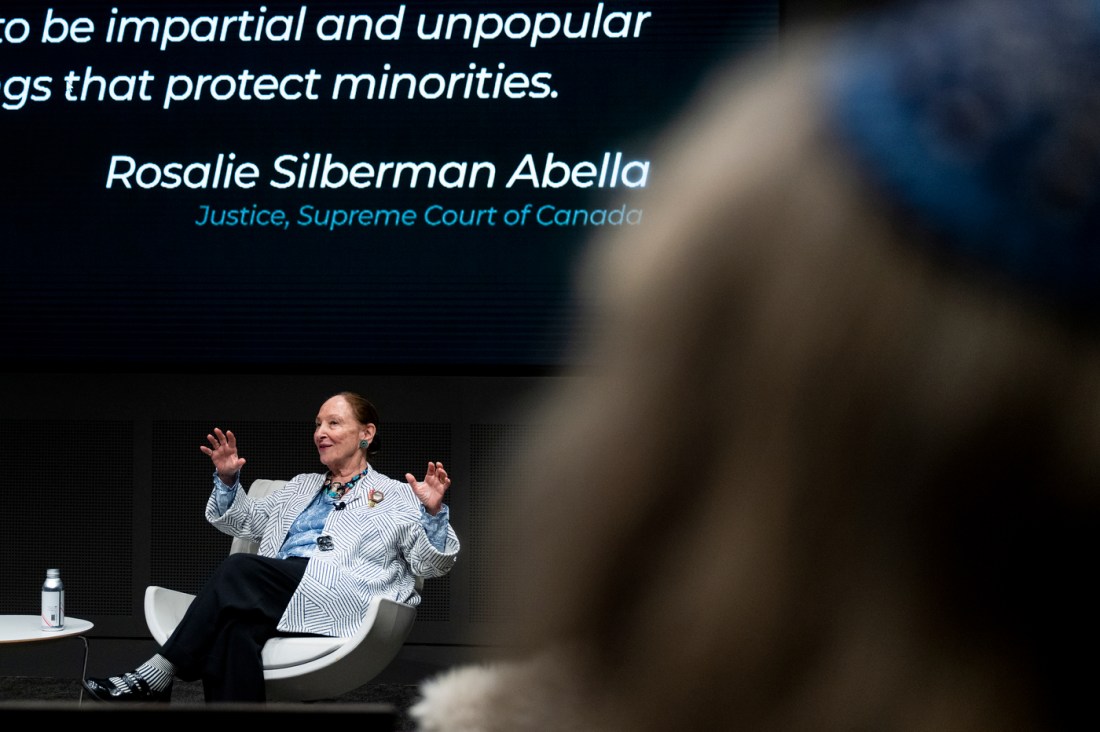 A speaker addresses an audience during a campus lecture event.