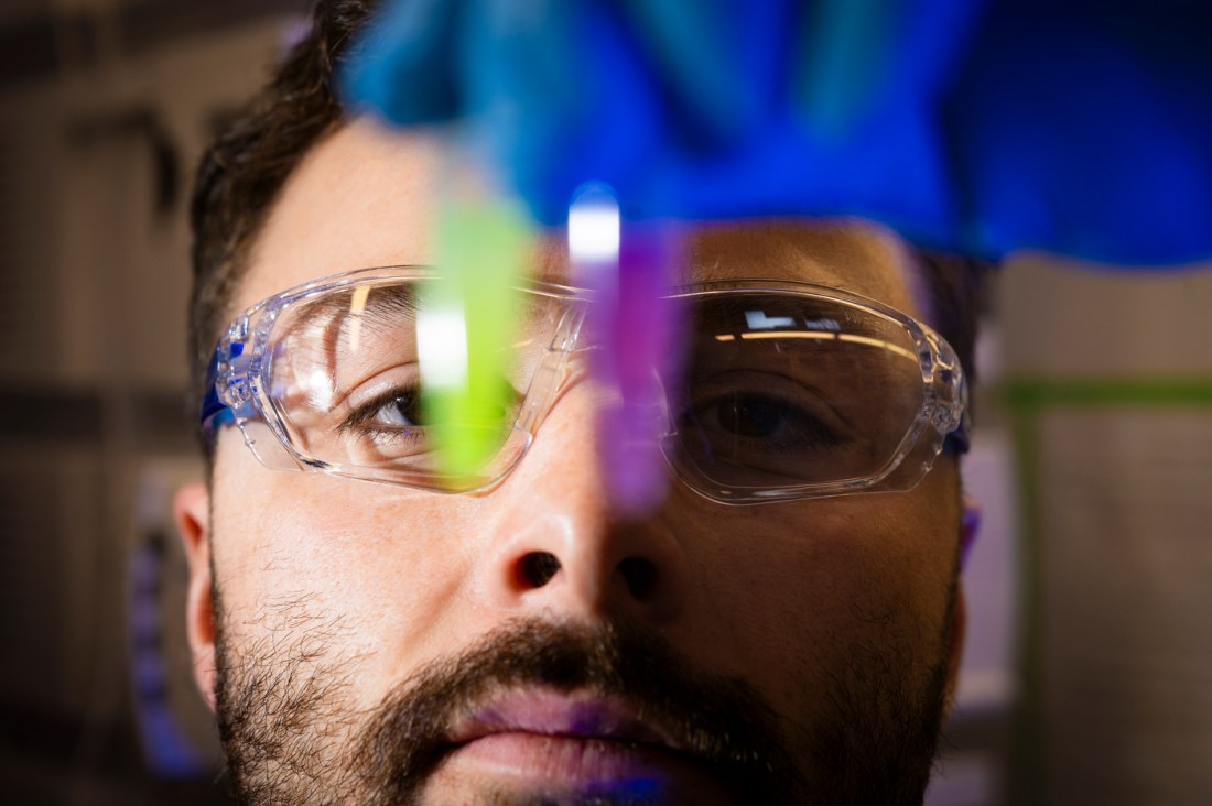 Justin Hayes prepares a sample while researching probiotic for gut health at Northeastern.