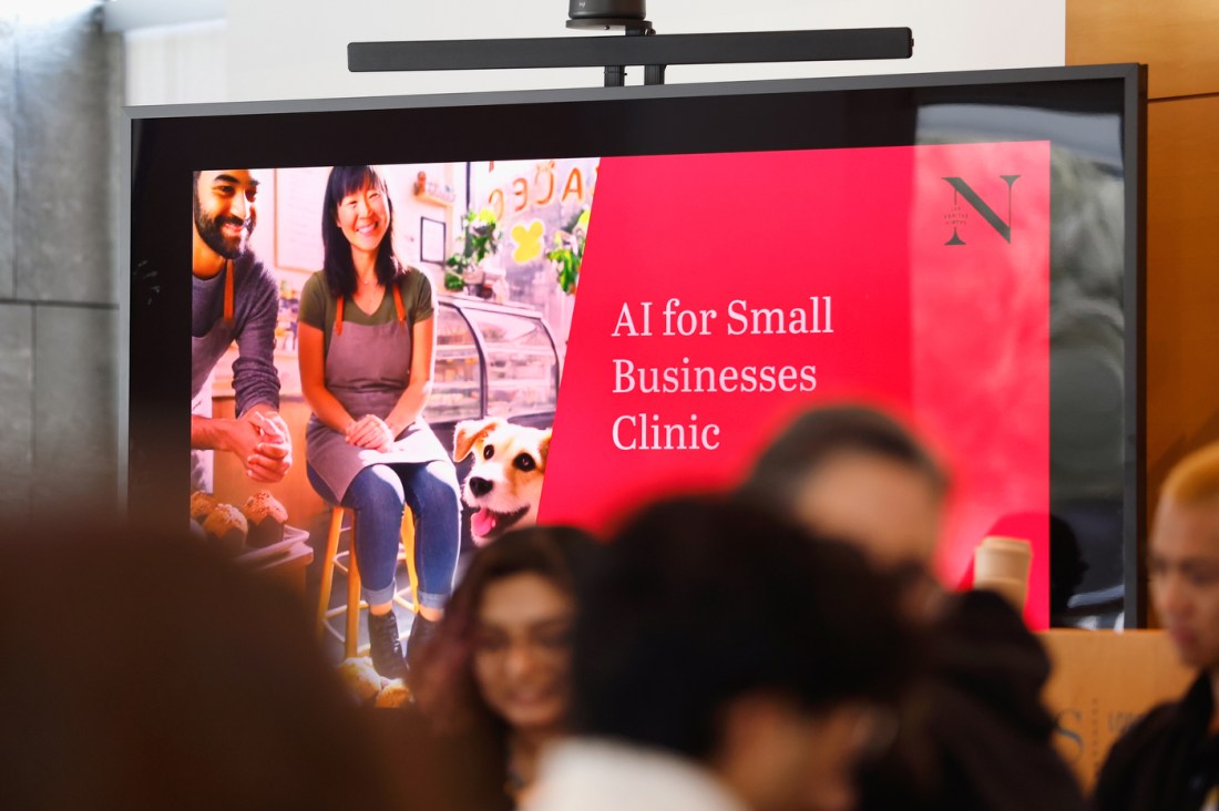 A screen displaying a title slide that says 'AI for Small Businesses Clinic' on it.