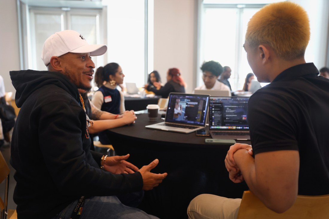 A student speaking with a small business owner.