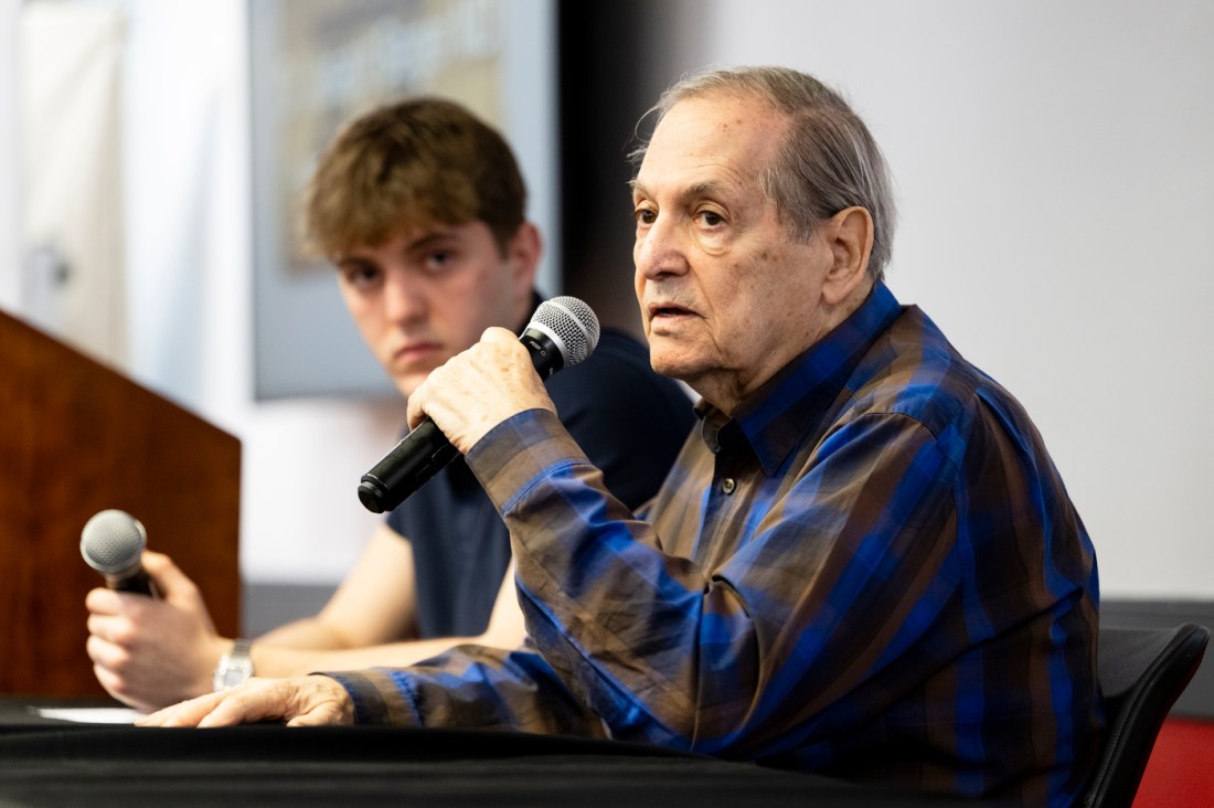 Noah Ben-Zion and Dr. Joseph Berger speaking into microphones.