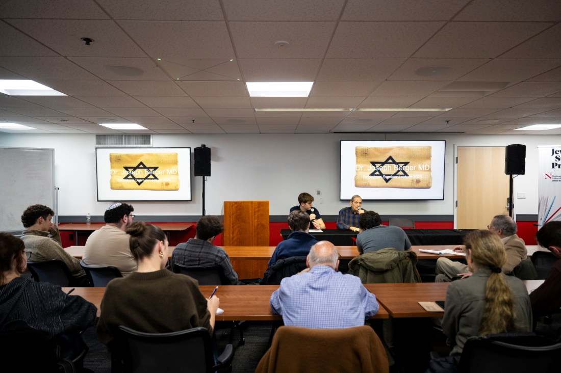 Noah Ben-Zion and Dr. Joseph Berger sitting in a room at a Holocaust Week Survivor Lecture.