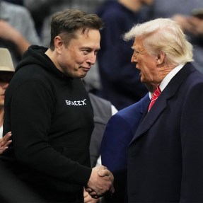 Elon Musk and Donald Trump shaking hands.