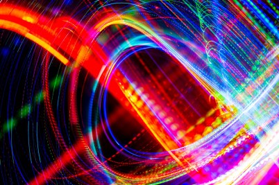 Digital lines of various colors swirling across a black background.