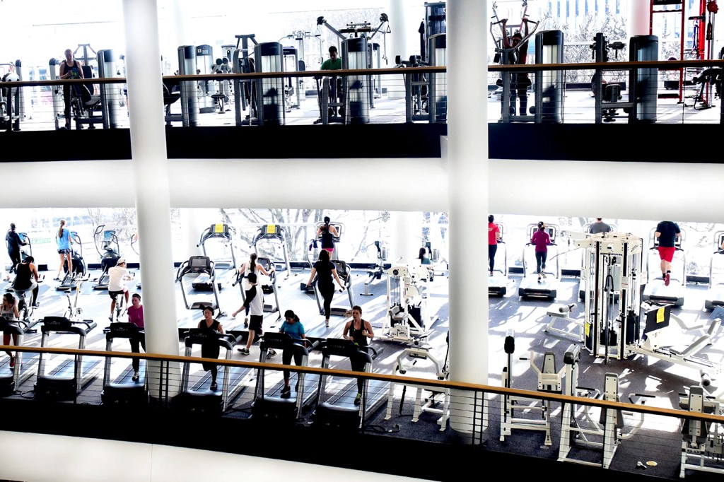 People working on on treadmills and other gym equipment machines in Marino, a gym on the Boston Campus.
