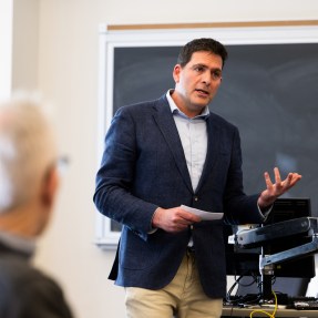 A professor speaks during a panel with alumni and entrepreneurs from startup program.