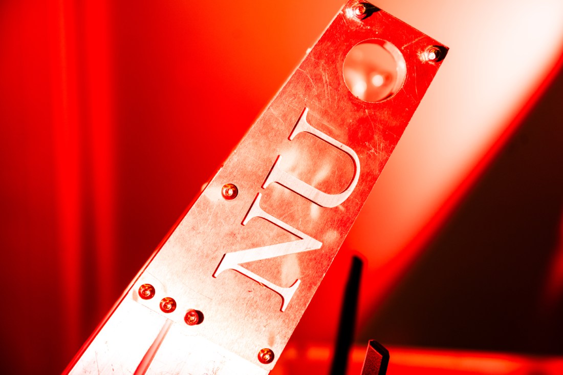 A part of a Lunabotics robot that has 'NU' on it.