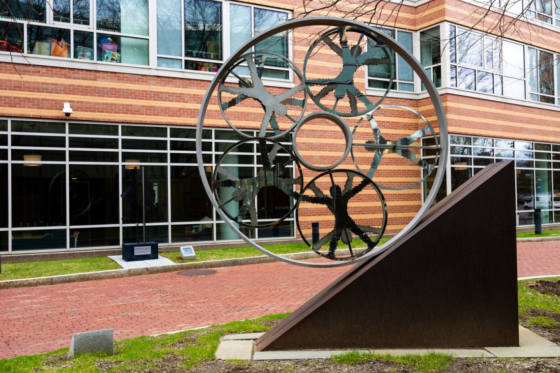 A stainless steel sculpture in the shape of a circle with several circles within.