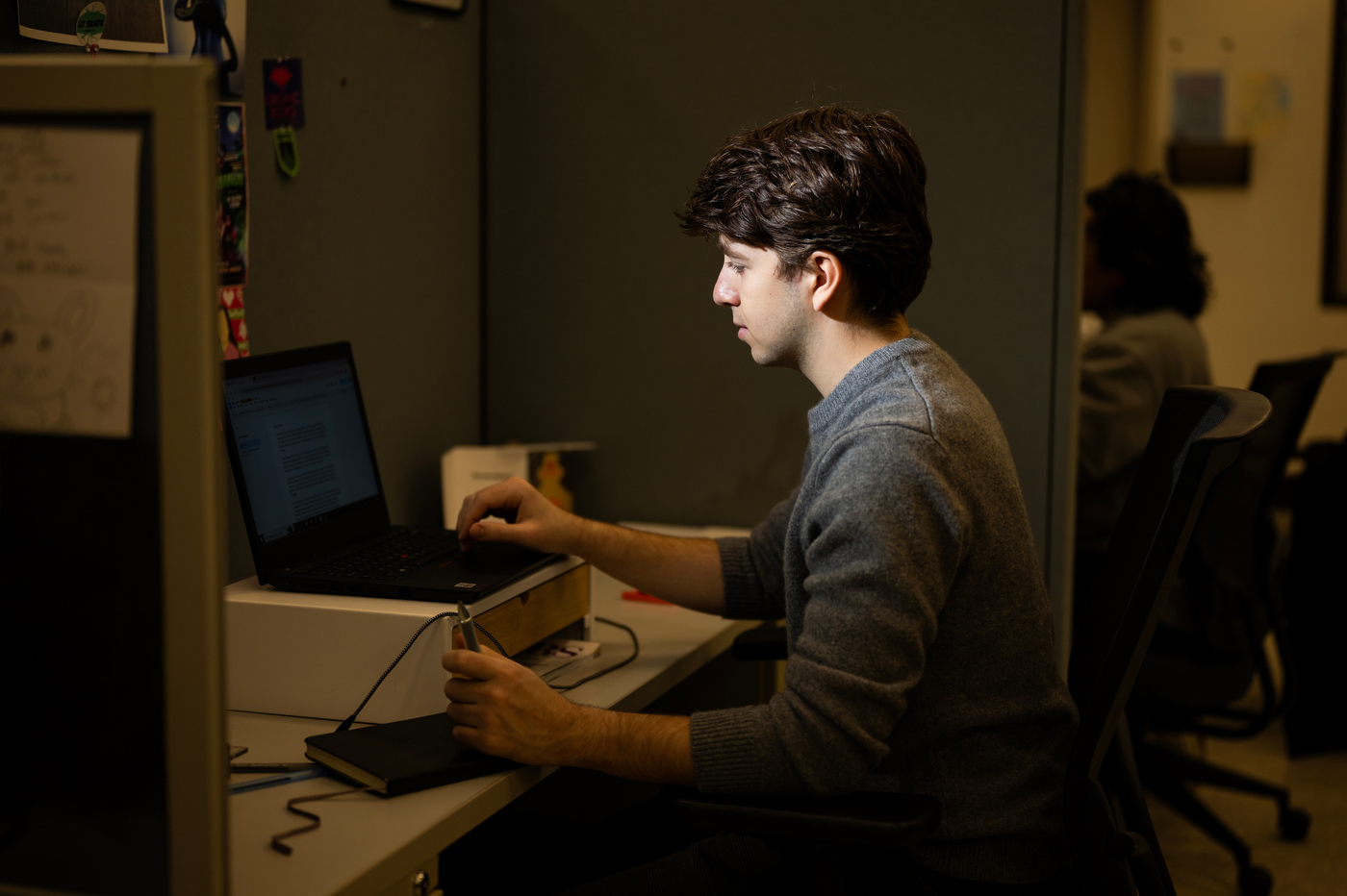 Eli Curwin typing on a laptop.