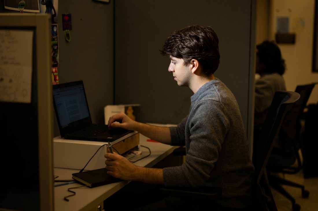 Eli Curwin writing a speech.