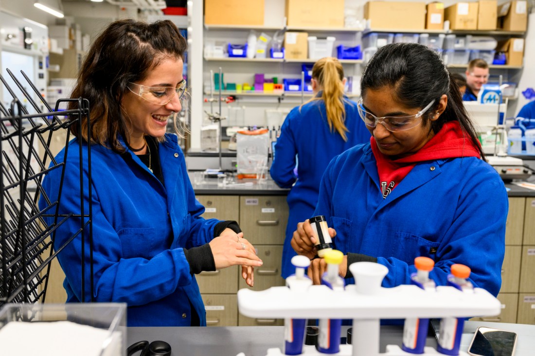 Students working on developing cosmetics in a lba.