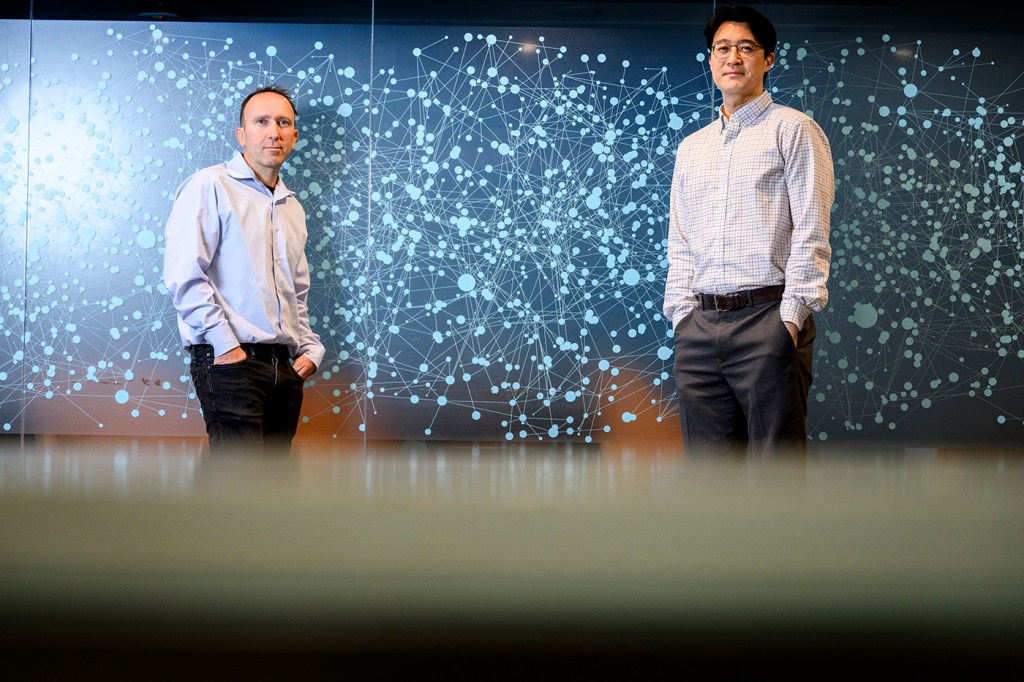 Udi Hoitash and Jaehan Ahn posing for a portrait.