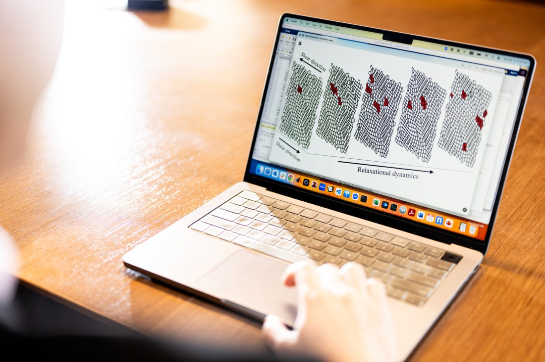 A laptop showing tissue regeneration models. 