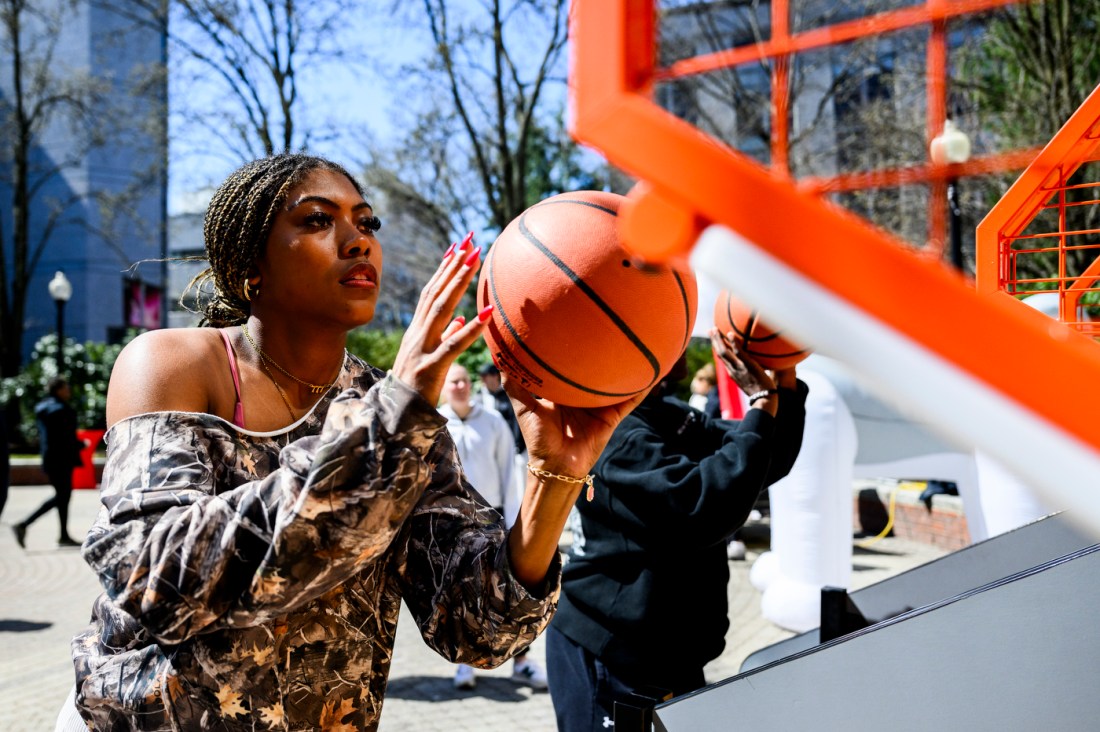 A person shooting a basketball at Giving Day 2025.