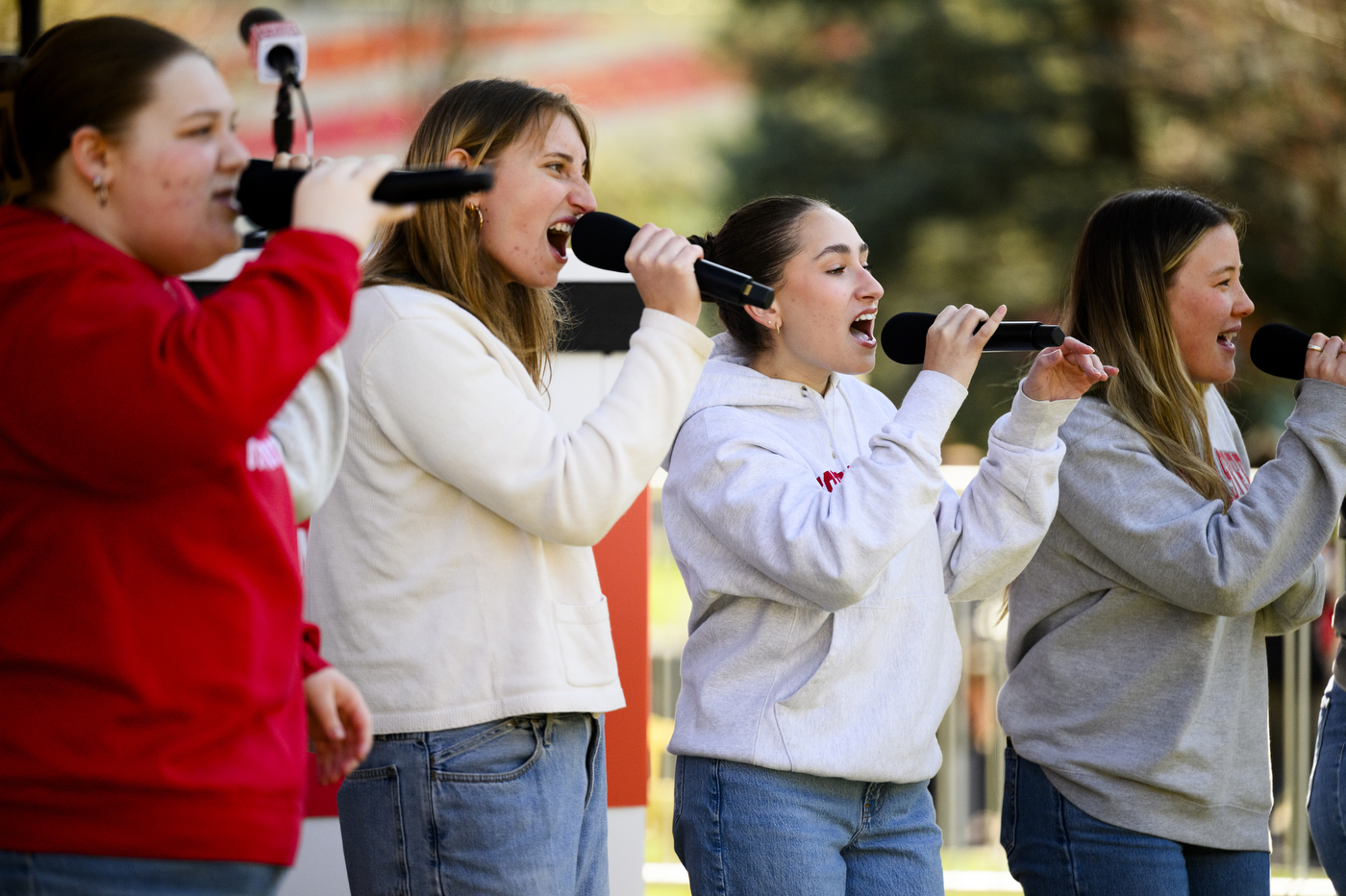 An a capella group singing on stage at Giving Day.