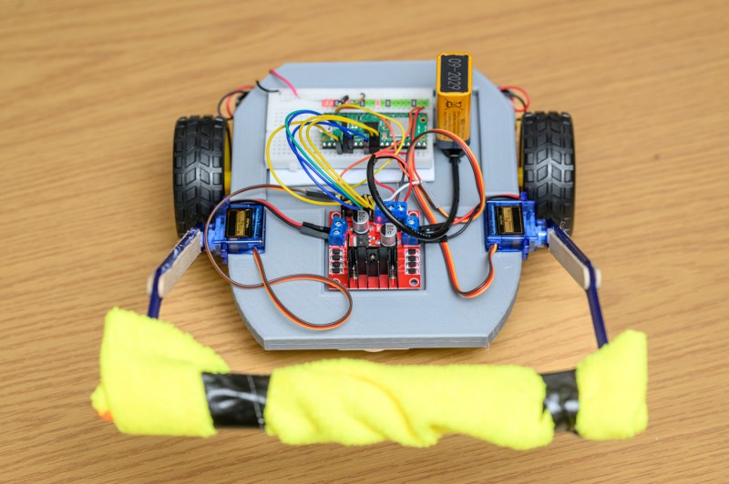 A student-engineered robot on wheels.