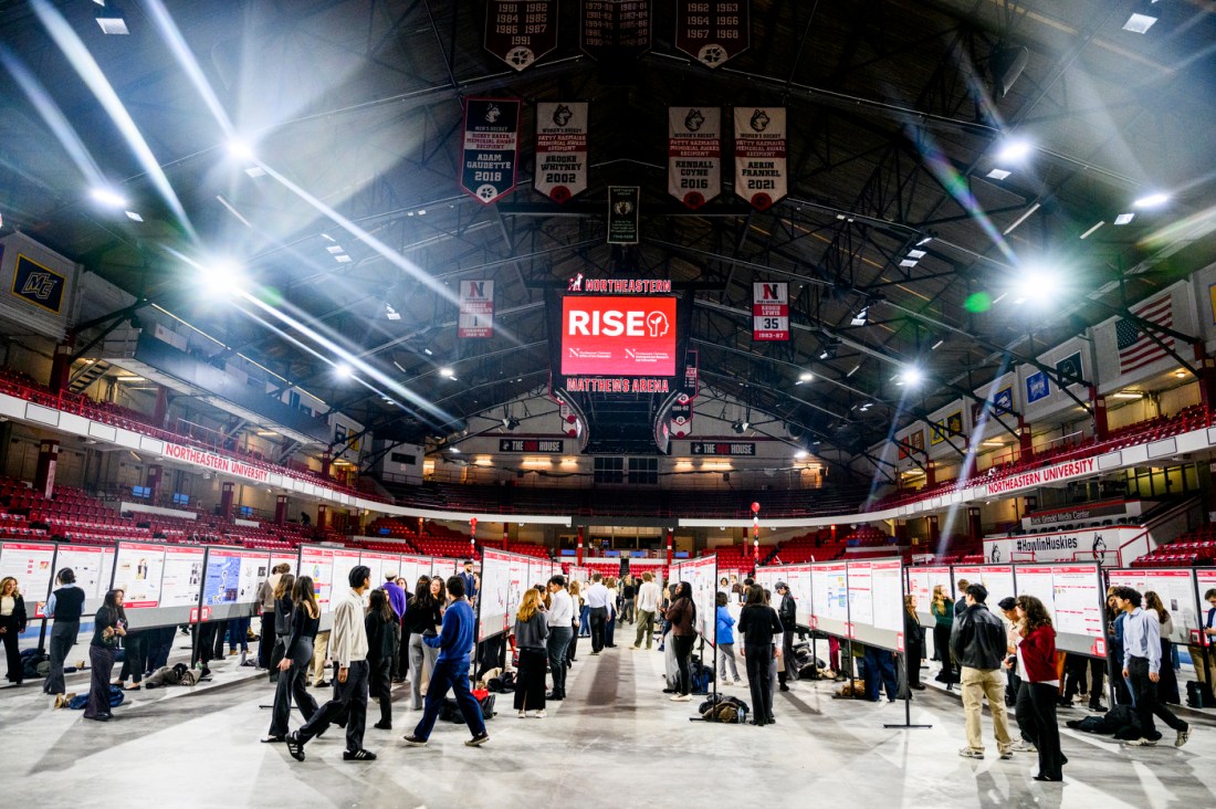 Rows of posters in Matthews Arena for the RISE Expo.