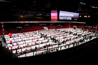 Rows of posters in Matthews Arena for the 2025 RISE Expo.