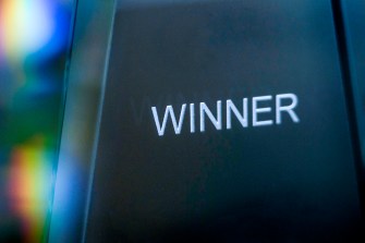 A trophy that says 'WINNER' on it.