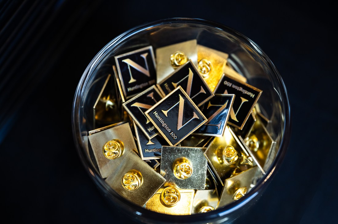 A jar full of Northeastern branded pins.