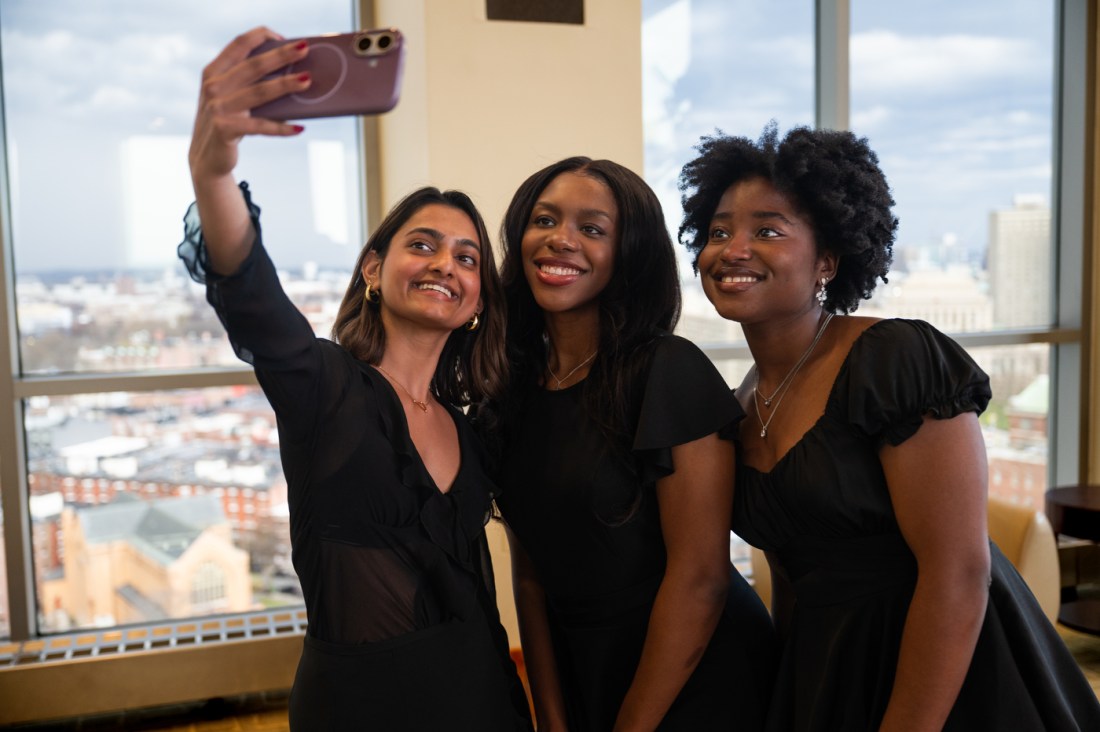 Three people taking a selfie together at the Huntington 100 Induction Ceremony.