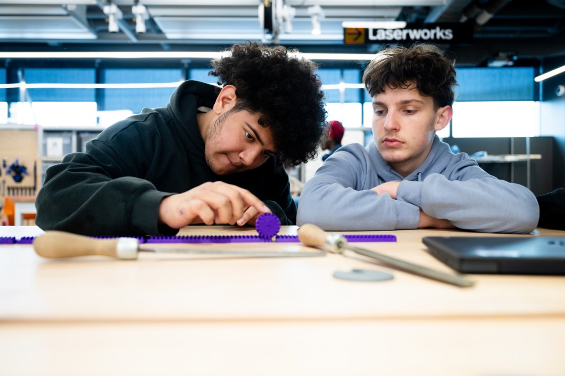 Steven Ramos and Nolan Nash working on a project in the EXP Makerspace.