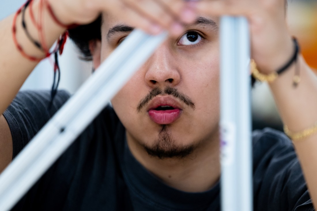 A high school senior working on a project in the EXP makerspace.