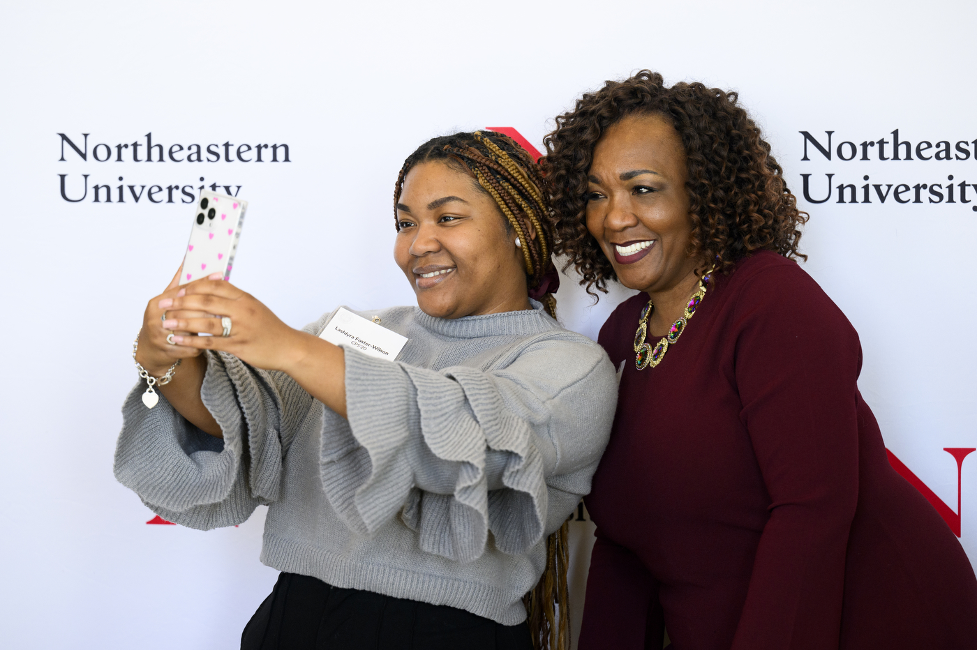 Two people taking a selfie at the 25 Year Associates Brunch.