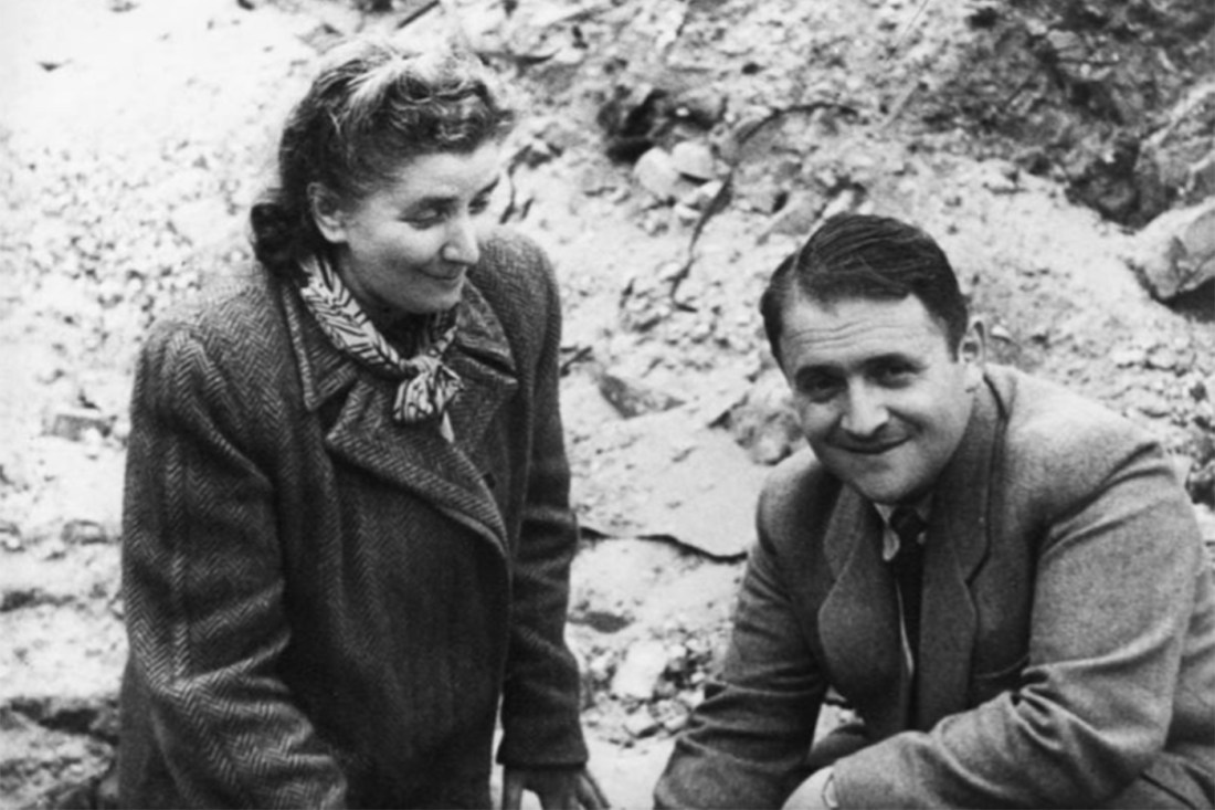 Hersh Wasser smiling with rocks and dirt in the background.