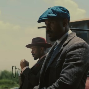 A screen capture of Michael B. Jordan playing twins in the movie 'Sinners'.