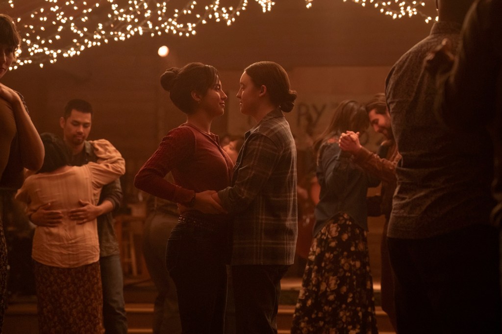 A screen capture of two characters facing each other and dancing in The Last of Us.