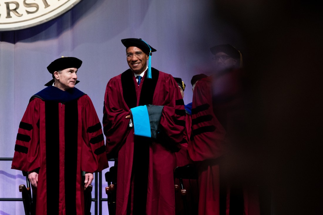Andrew Michael Holness receiving his degree on stage.