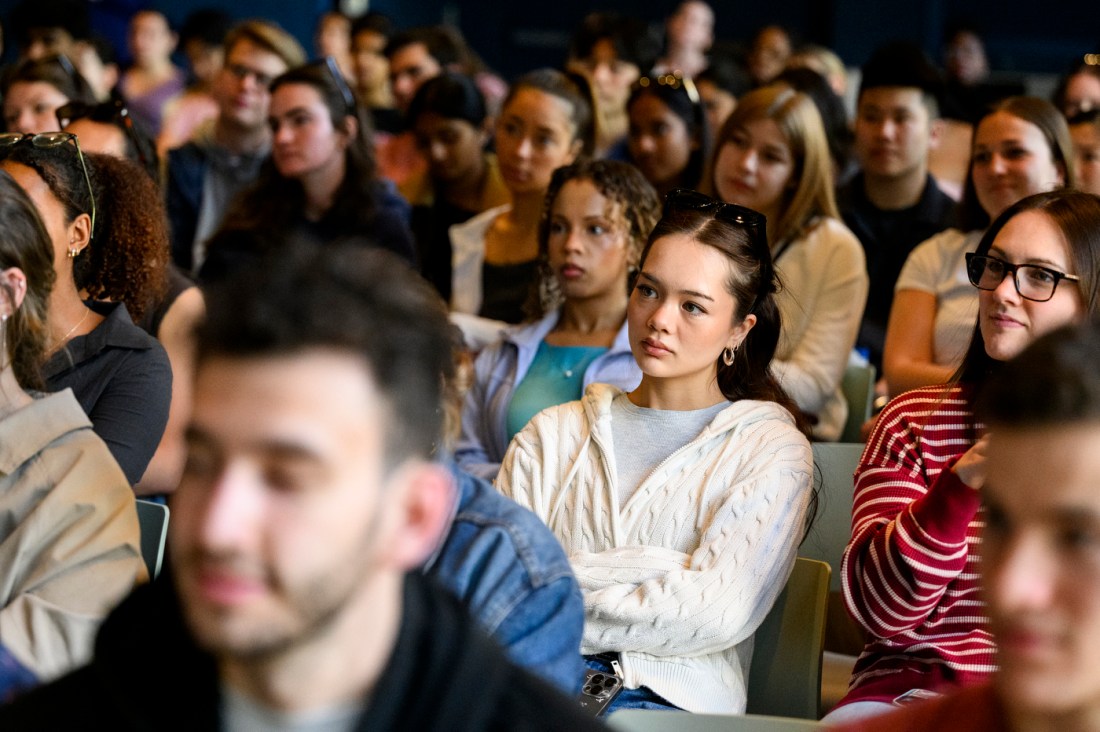 Audience members listening intently as William Sharp gives the last lecture.