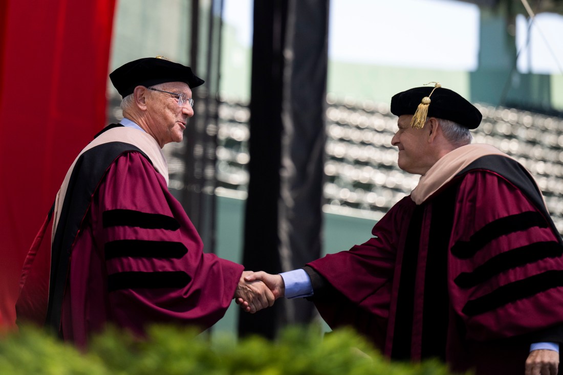 David Roux is greeted by President Joseph Aoun at Commencement.