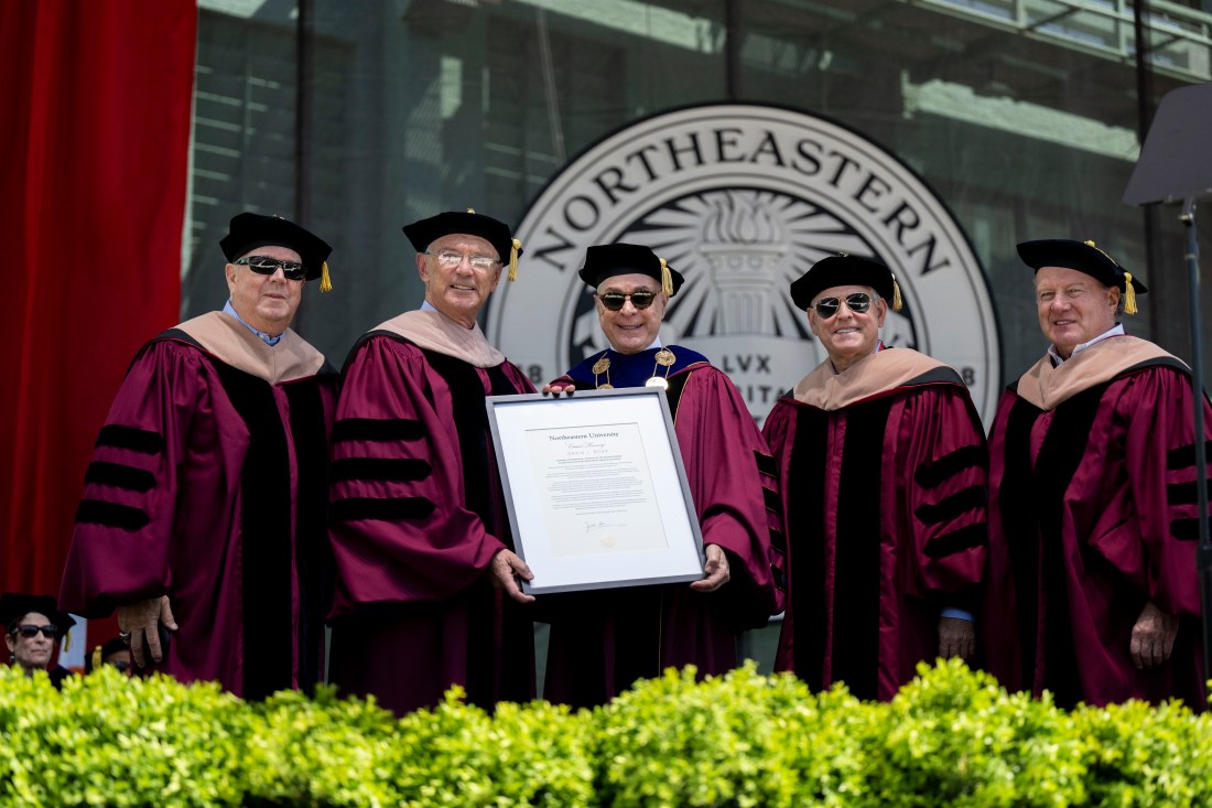 David Roux poses with Northeastern leadership after receiving a citation. 