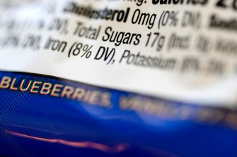 Close-up of a food label showing total sugar content and daily value percentage.