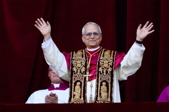 Pope Robert Francis Prevost Leo XIV greets the crowd from the balcony of St. Peter’s Basilica after his election in Vatican City.