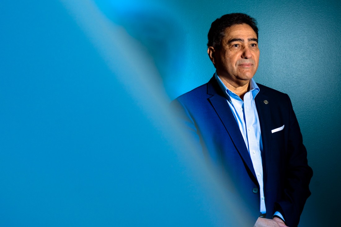 Portrait of Ahmed Busnaina wearing a suit and smiling.