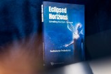 A book with a blue cover and the title &#039;Eclipsed Horizons&#039; on it in white. There is also a humanoid figure with an enlarged DNA strand coming out of the chest.