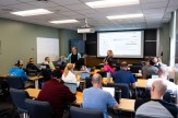 Faculty attend a workshop in a classroom setting.