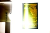 Steve Lustig seen through a brightly colored yellow translucent material in the lab. He is wearing safety glasses.