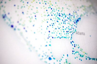 A disease prediction model that shows small turquoise and blue dots on a map of the United states.