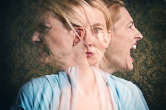 A surreal image of a woman in a blue shirt battling inner feelings, visualized to her left and right.