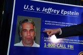 A prosecutor points to a blue FBI poster bearing the face of convicted sex trafficker Jeffrey Epstein.