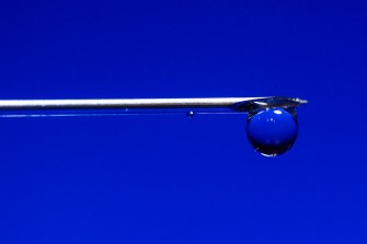 A sharp object set against a navy blue background.