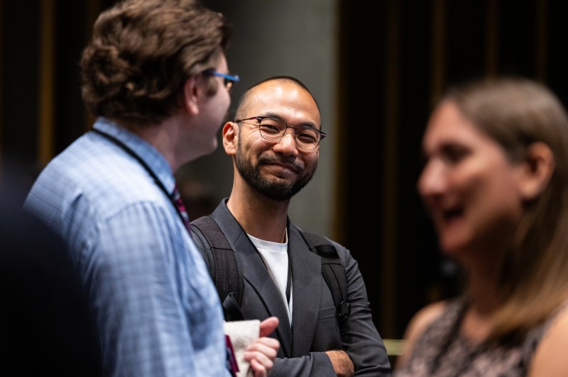 New faculty members speak to each other at a new faculty member event.