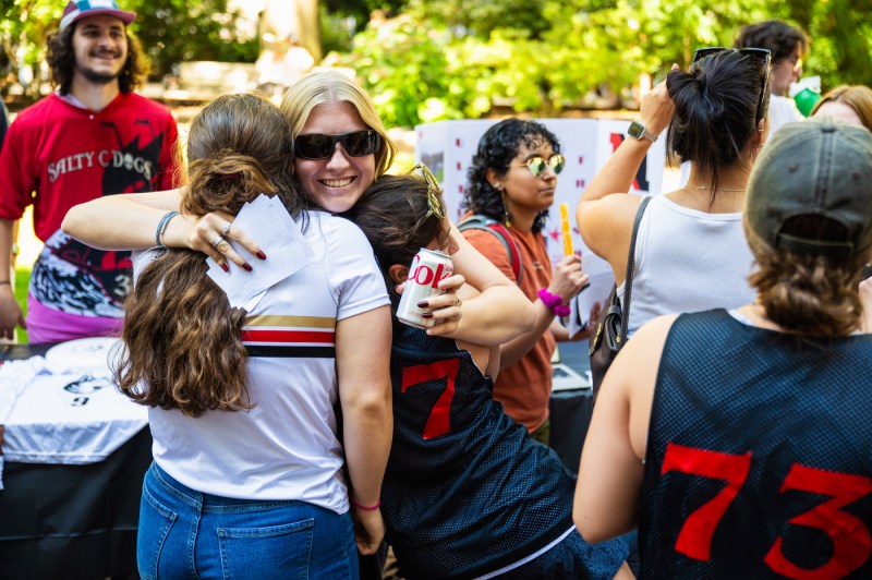 Students hug each other at Fall Fest.